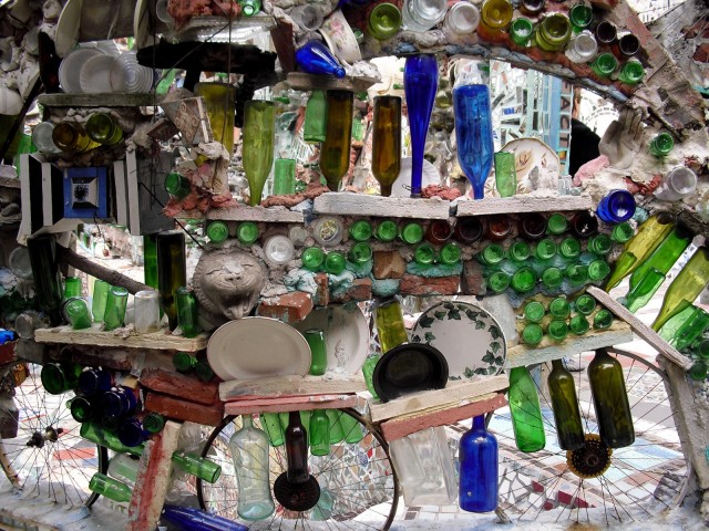 Colorful pieces of plates, bottles and glass objects form a 3-D mural in Philadelphia, PA #visitphilly #PATravelHappy @GetawayMavens