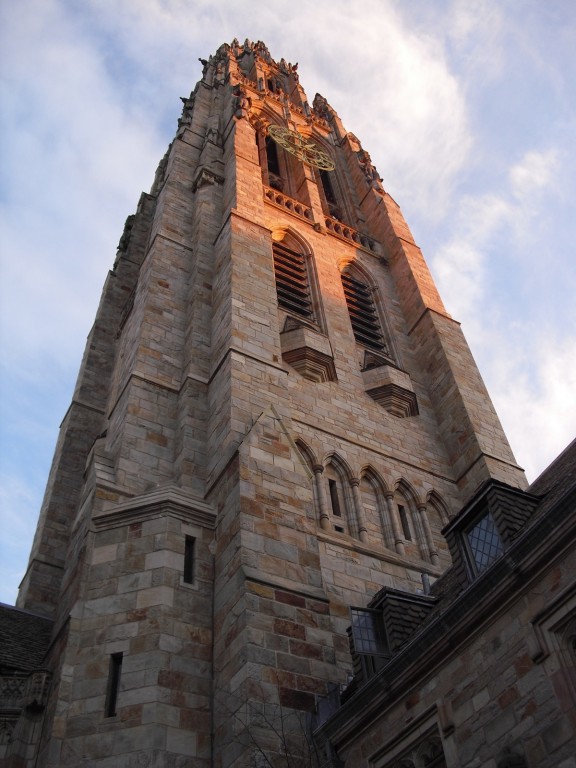 Gothic tower of Yale University shot skyward at sunset. Yale University, New Haven, CT