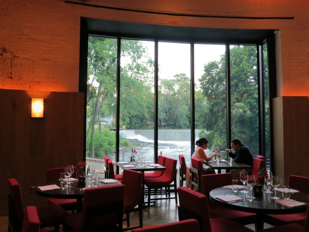 Dining by window overlooking waterfall and Fishkill Creek, Beacon, NY