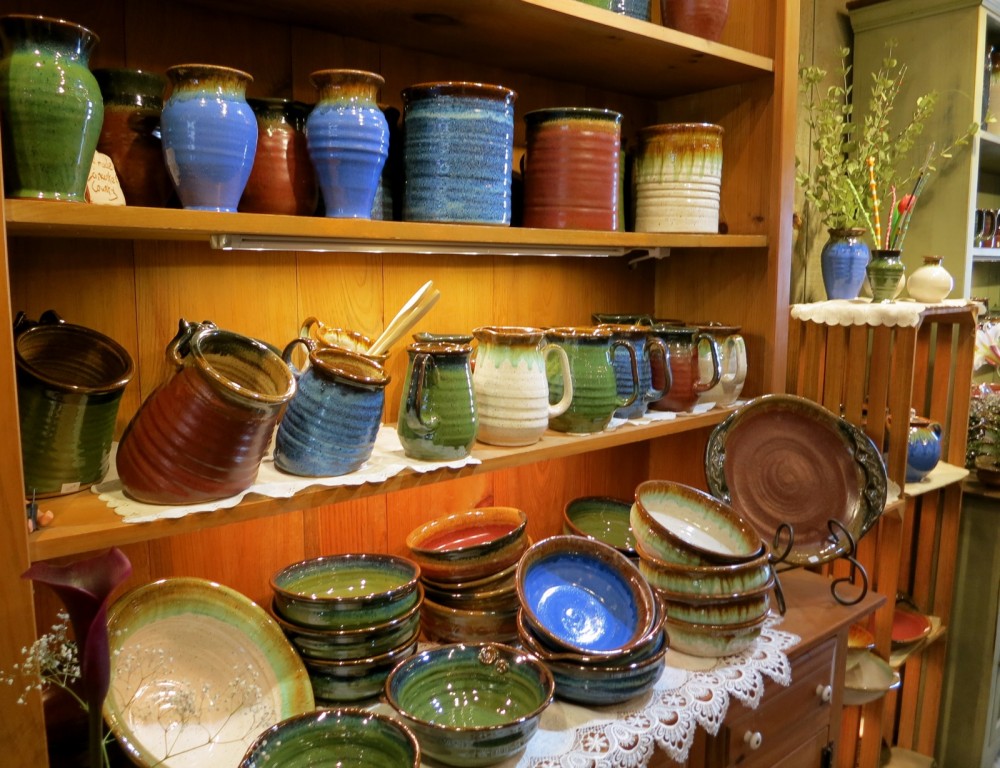 Vibrantly colored pottery line shelves in Kitchen Kettle Village