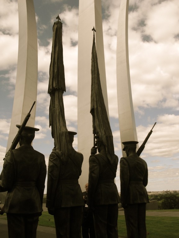 Sculpture of Four Honor Guards Stand Sentry in Foreground of Air Force Memorial Spires Arlington, VA