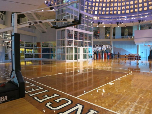 Visitors shoot hoops on large court at the Basetball Hall of Fame in Springfield MA