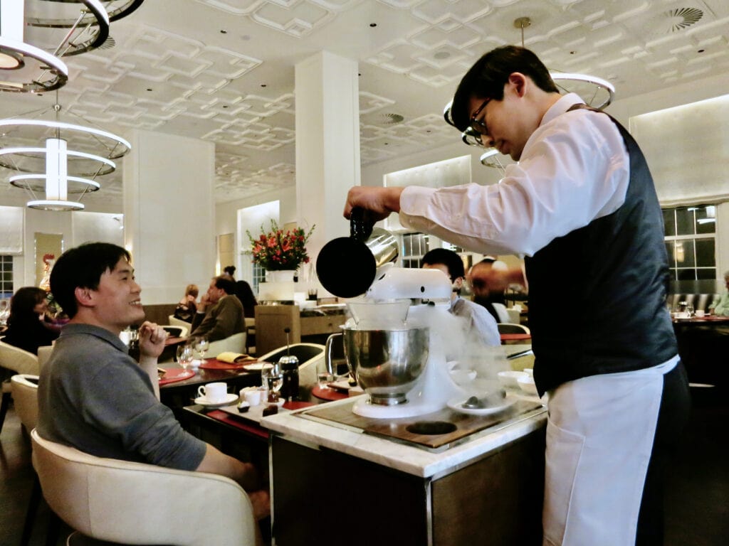 Pouring artisanal soup at restaurant Bocuse - Culinary Institute of America NY