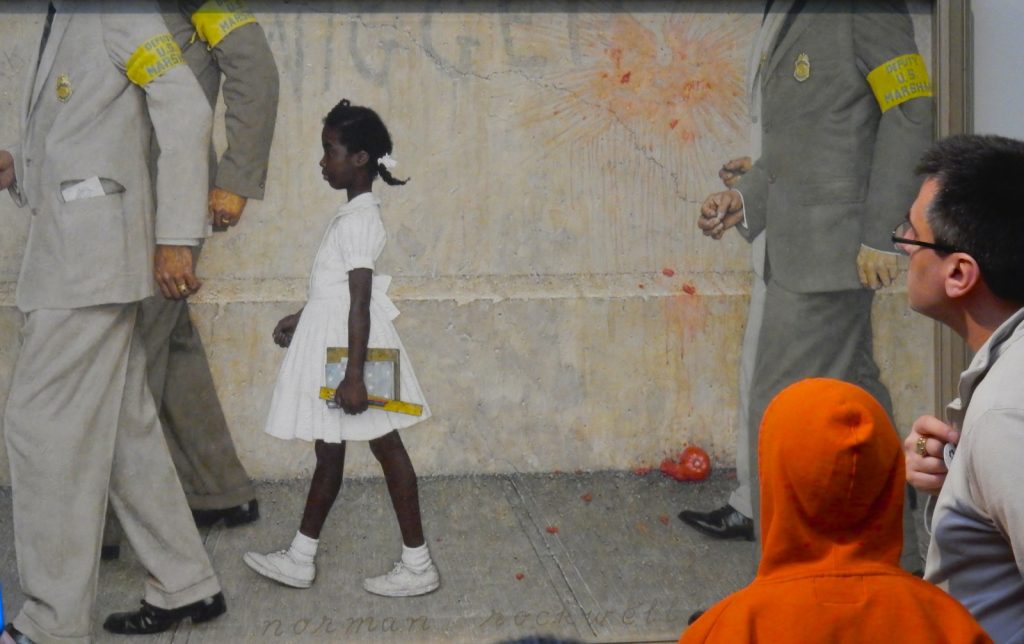 Museum visitors looking at Painting of Ruby Bridges Norman Rockwell Museum Stockbridge MA