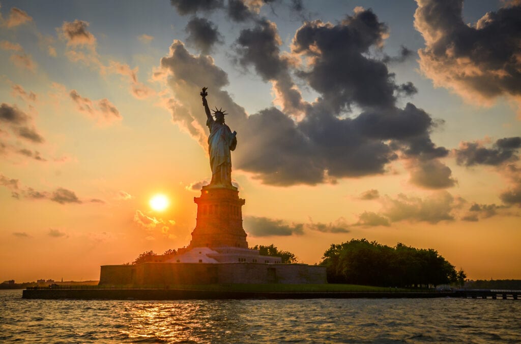 Watch a sunset paint the Statue of Liberty on a romantic getaway in Downtown NYC.