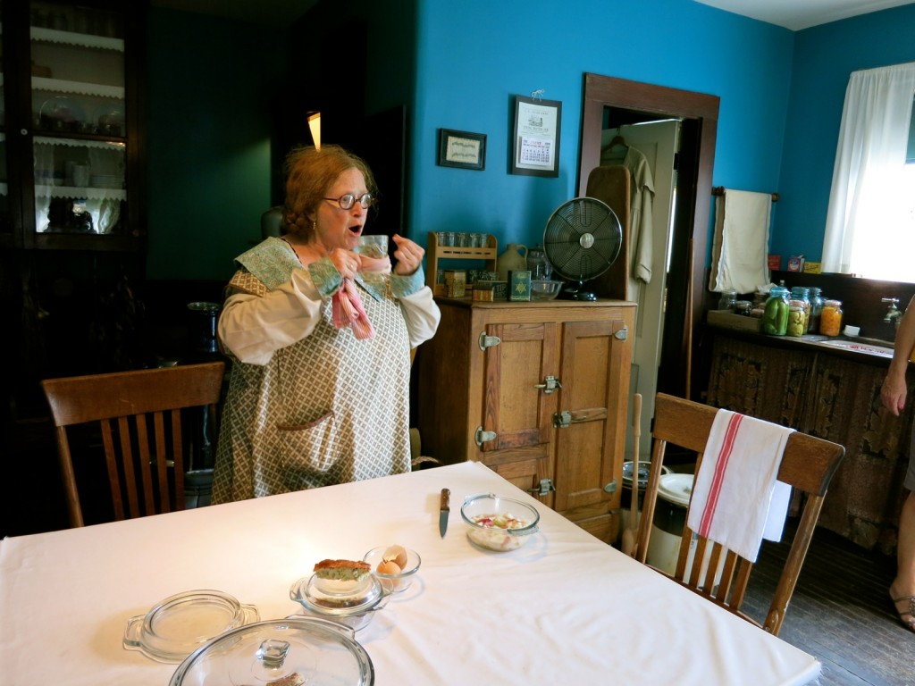 Sheva Shapiro demonstrates Russian method of drinking tea through a sugar cube at Strawbery Banke Museum, Porstmouth NH