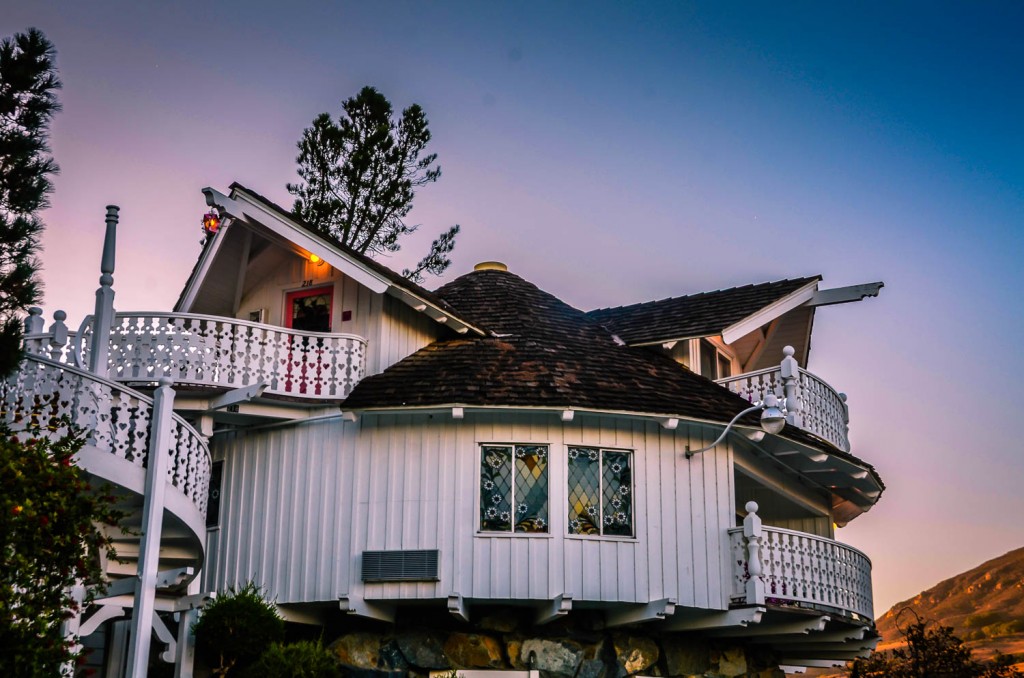 Madonna Inn hotel room - Carin - exterior view with winding staircase and mountain backdrop.