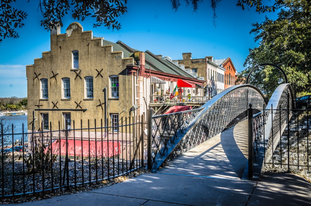 Upper Factor Walk's picturesque wrought iron bridge and buildings are a holdover from when cotton was king in Savannah, Georgia. 