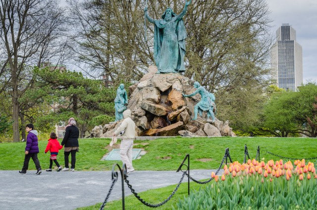 Tulip bed surround statue of Moses Smiting Rock (J. Massey Rhind, sculptor, 1893.) Corning Tower building peeks out in the background. #Albany #NewYork @GetawayMavens