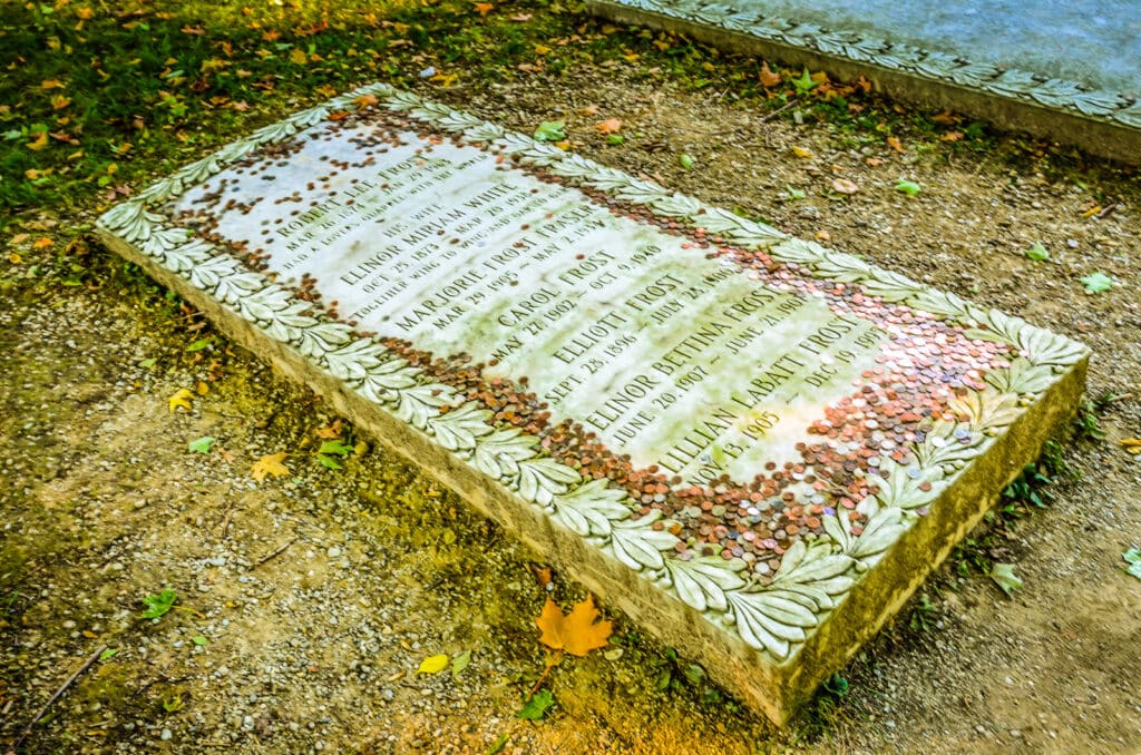 Copper pennies on the gravesite of poet Robert Frost