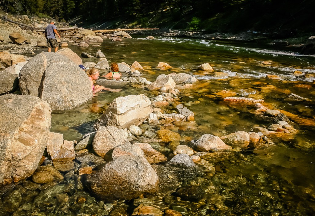 Girl soaks in Sunbeam Hot Springs iSawtooth National Recreation Area in Idaho.