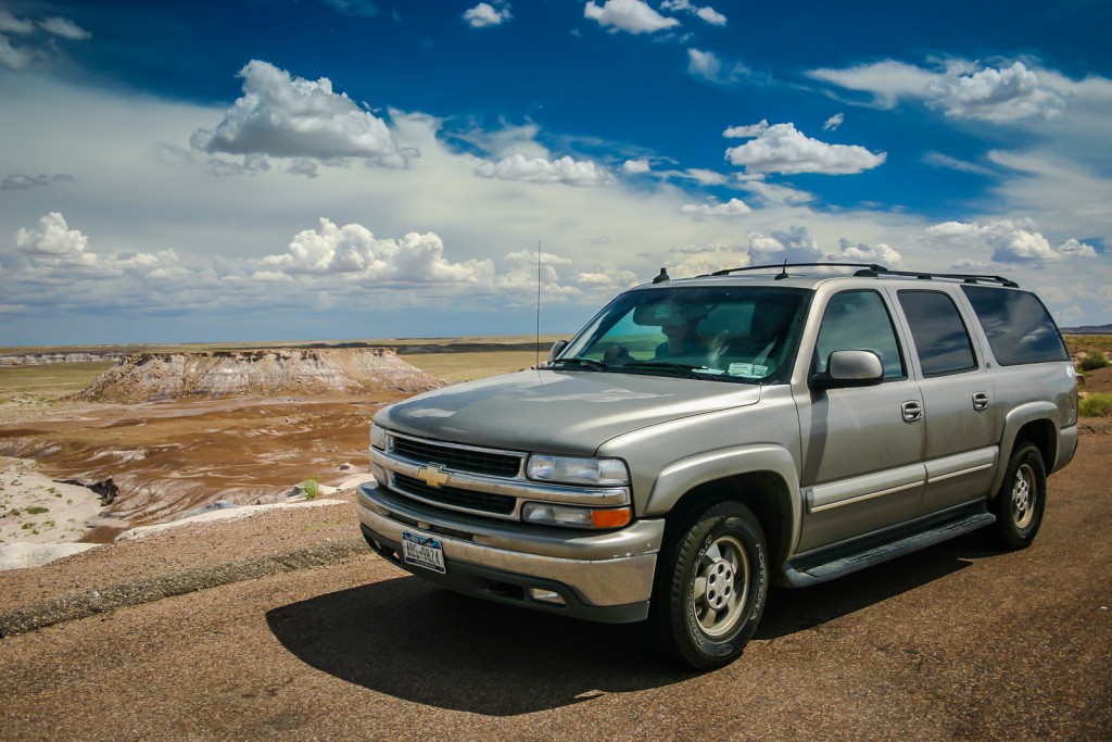 Suburban parked by red painted desert