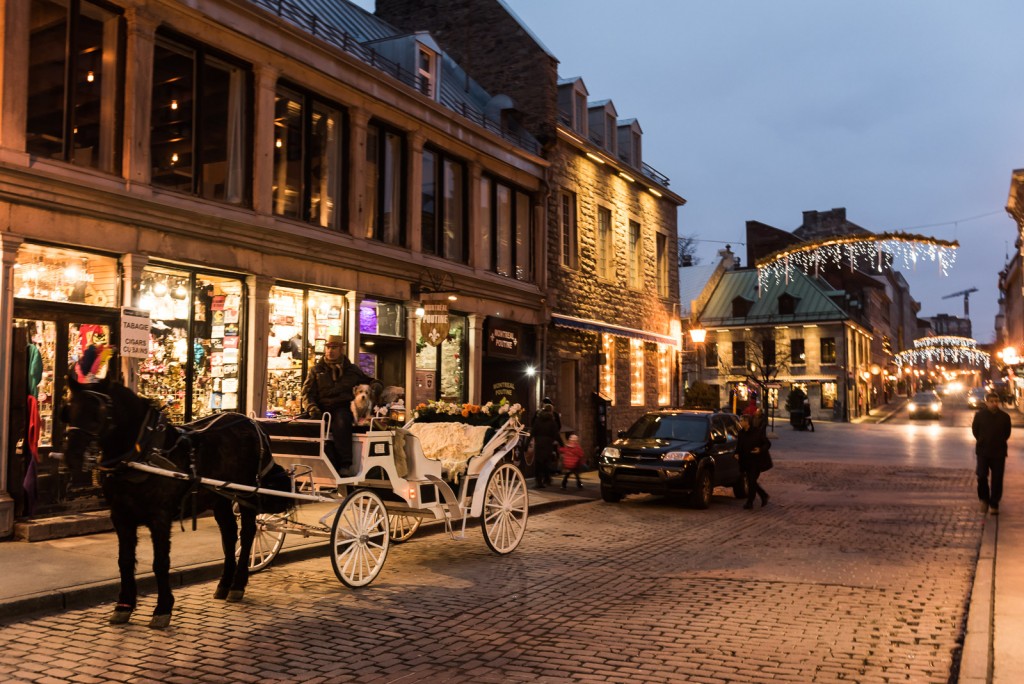 A white carriage awaits visitors on the 17th century cobble-stone streets of Old Montreal.