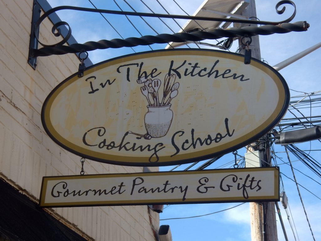 In The Kitchen Cooking School sign 
