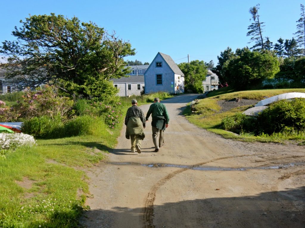 Holding hands on Monhegan Island path Maine