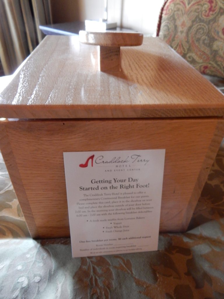 Hhefty wood shoebox that's used for breakfast room service delivery at the Craddock Terry Hotel in Lynchburg VA