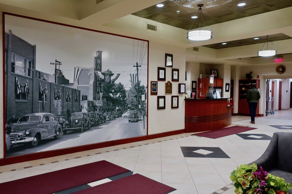 Hotel Warner lobby with photo mural of Warner Bros. Theater West Chester PA