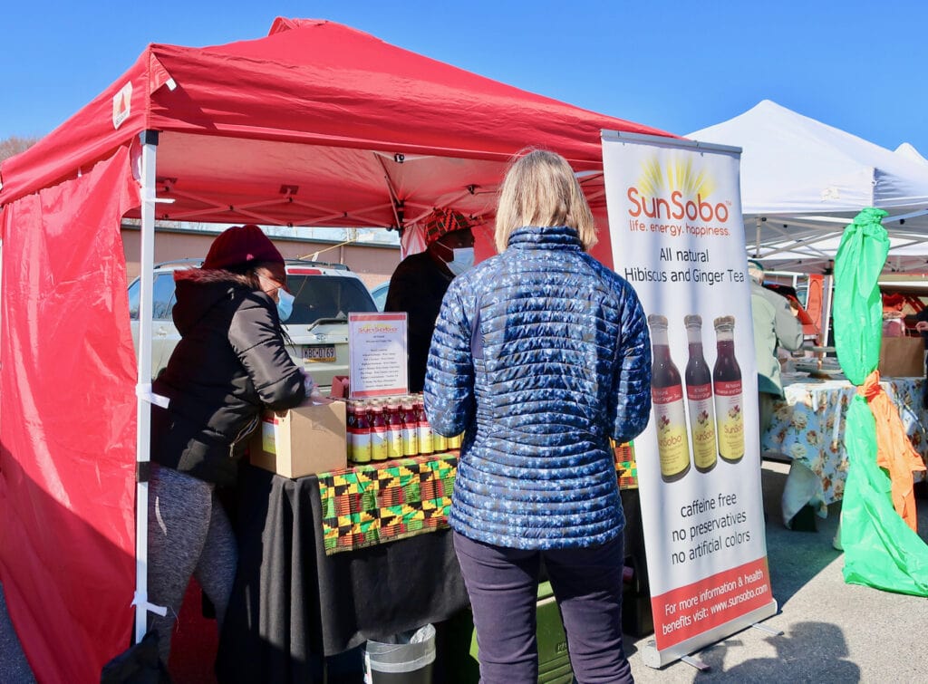 Sun Sobo drinks at Saturday market West Chester PA