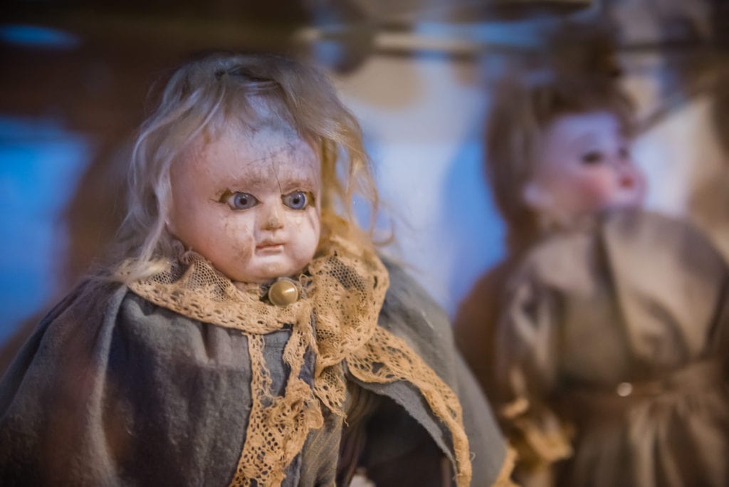 Creepy Victorian-era doll sits in display case at the Old Stone Fort Museum in Schoharie NY.