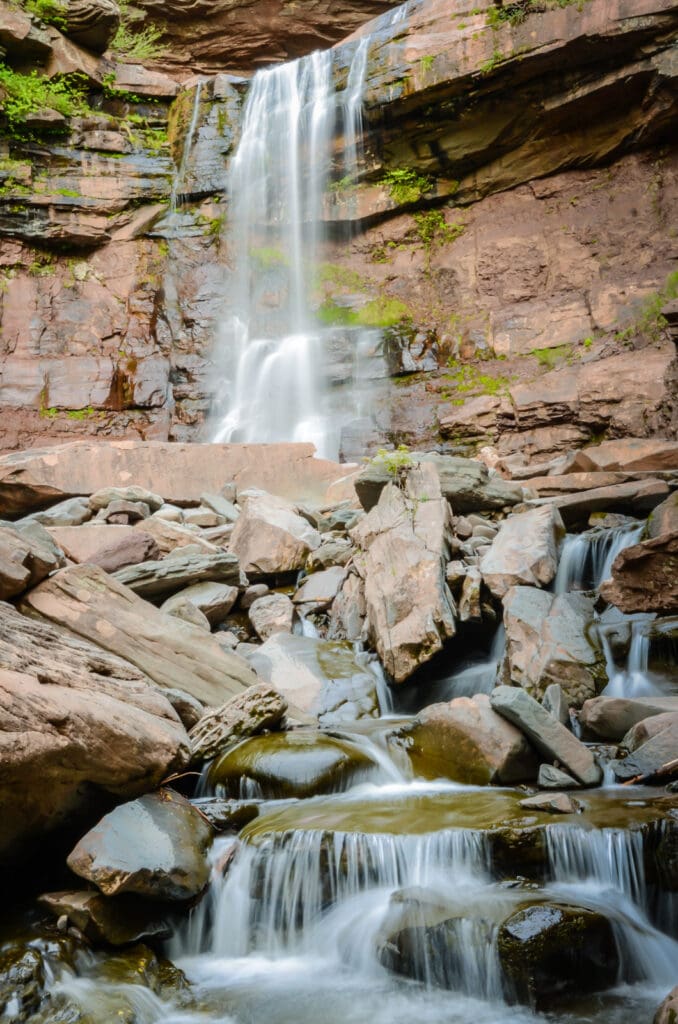 Cascading waterfall on Kaaterskill Falls trail in Catskills NY