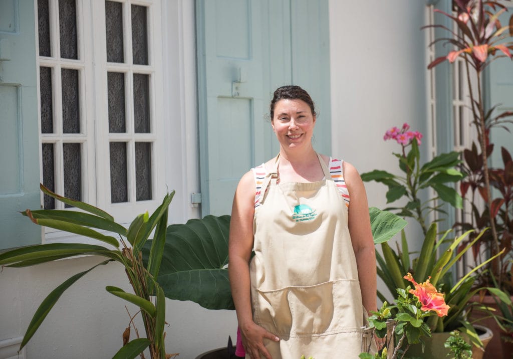 Jessica Geller, owner of At Home In the Tropics B and B, poses in the garden of the bed and breakfast in St. Thomas USVI