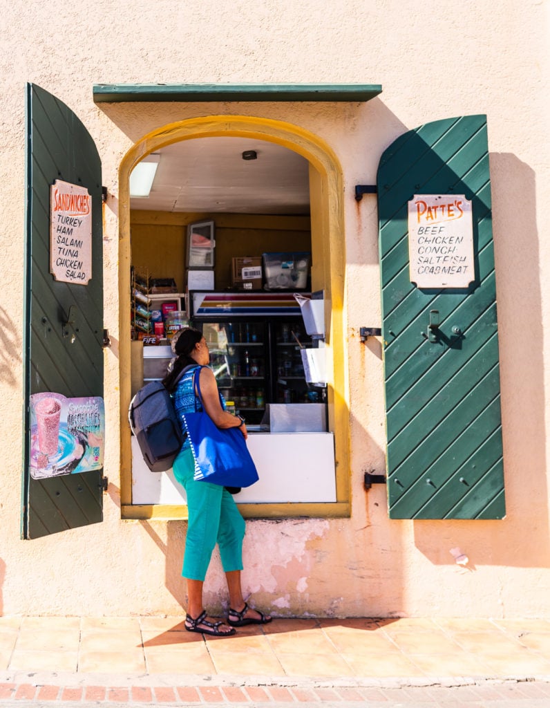 Tourist orders at the open window of the Ice Cream Shop on St. Thomas US Virgin Islands