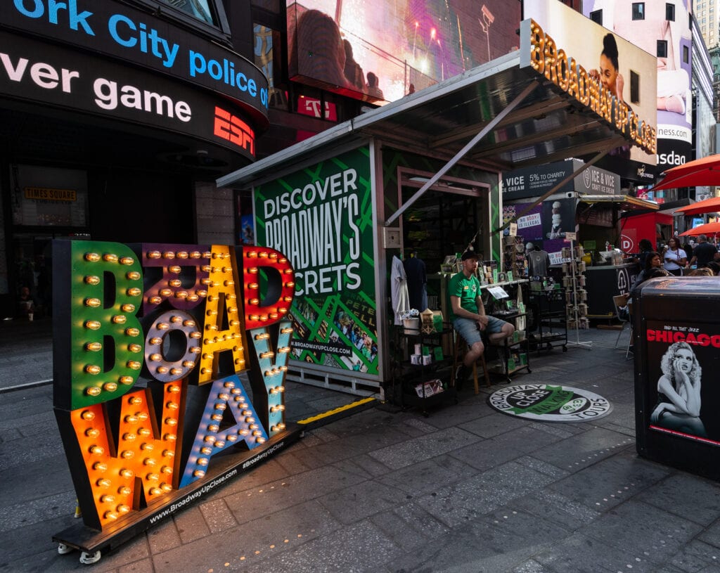 Broadway Up Close Walking Tours booth at Times Square