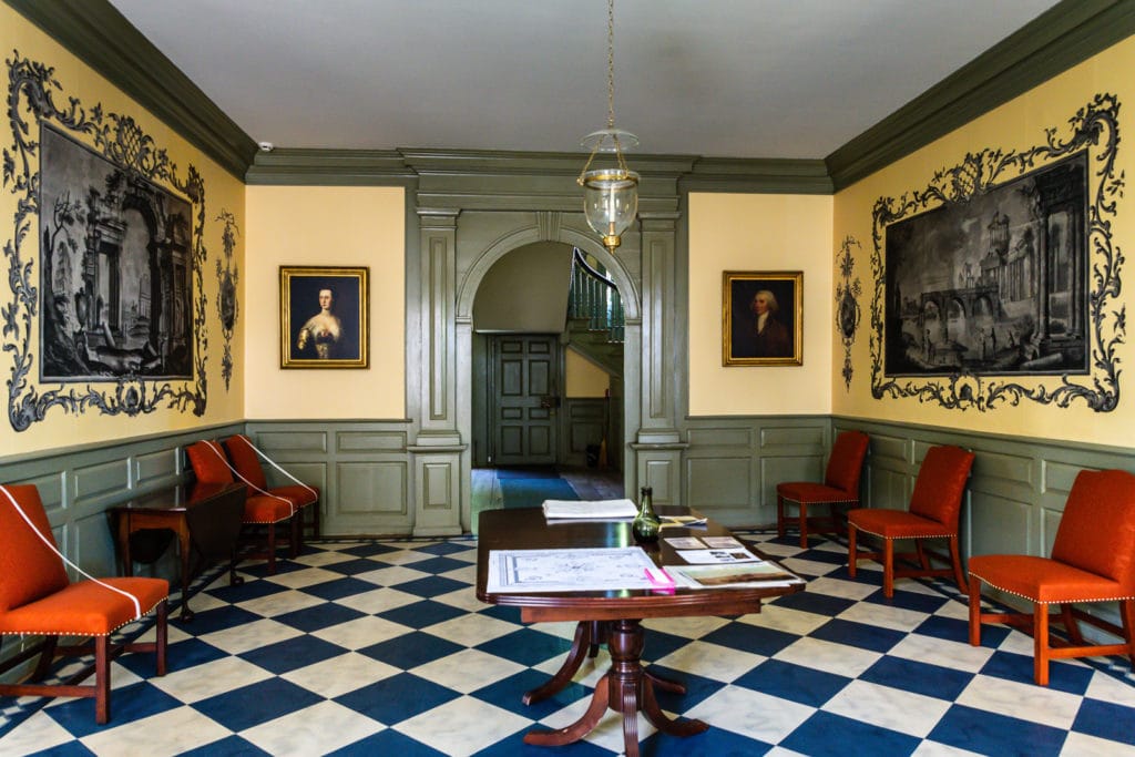 Schuyler Mansion interior with Ruins of Rome wallpaper in entry foyer.