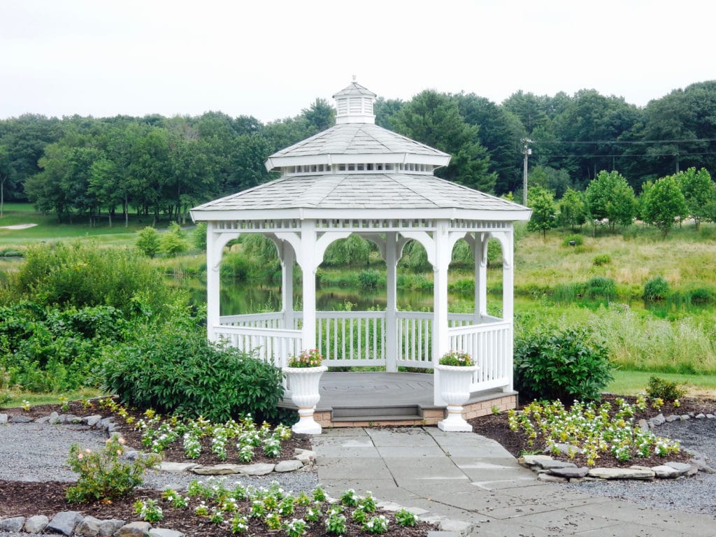 White gazebo with planted flowers around it at Mount Airy Casino