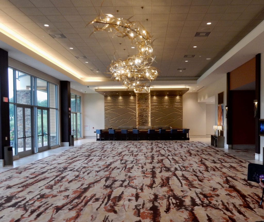 Glass ribbon chandelier in modern event space 
