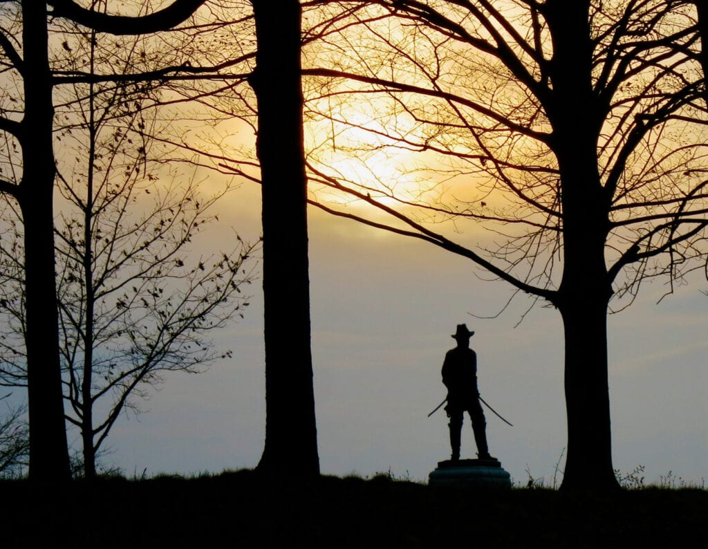 Statue of soldier in sunset Gettysburg National Battlefield