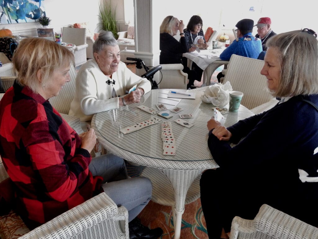 Guests playing cards on American Constitution Cruise Ship