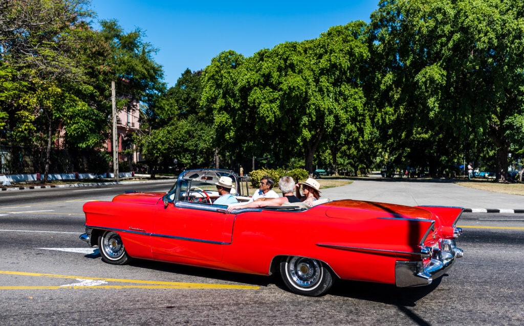 American tourists in Cuba taxi tour.