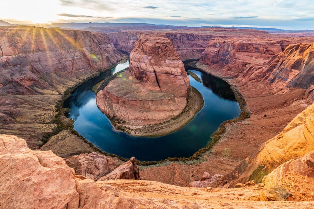 Sunset starburst at Horseshoe Bend Canyon in Page Arizona.