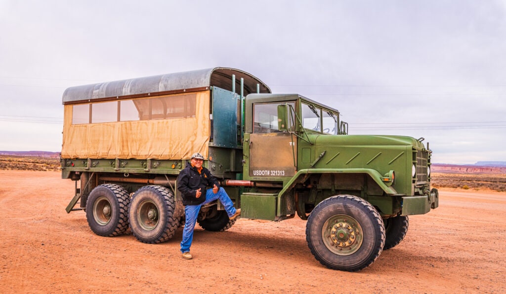  Tour guides Presley Ashley poses with former military vehicle that's now outfitted for Adventurous Antelope Canyon tours.