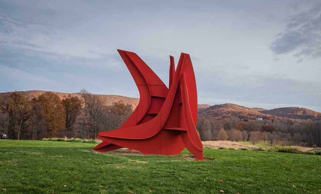 Five Swords, one of the monumental works by Alexander Calder at Storm King Outdoor Sculpture Center, seen against fall foliage backdrop.