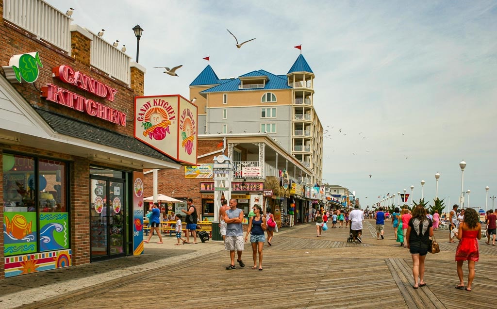 Couples strolling on the boardwalk in Ocean City MD.