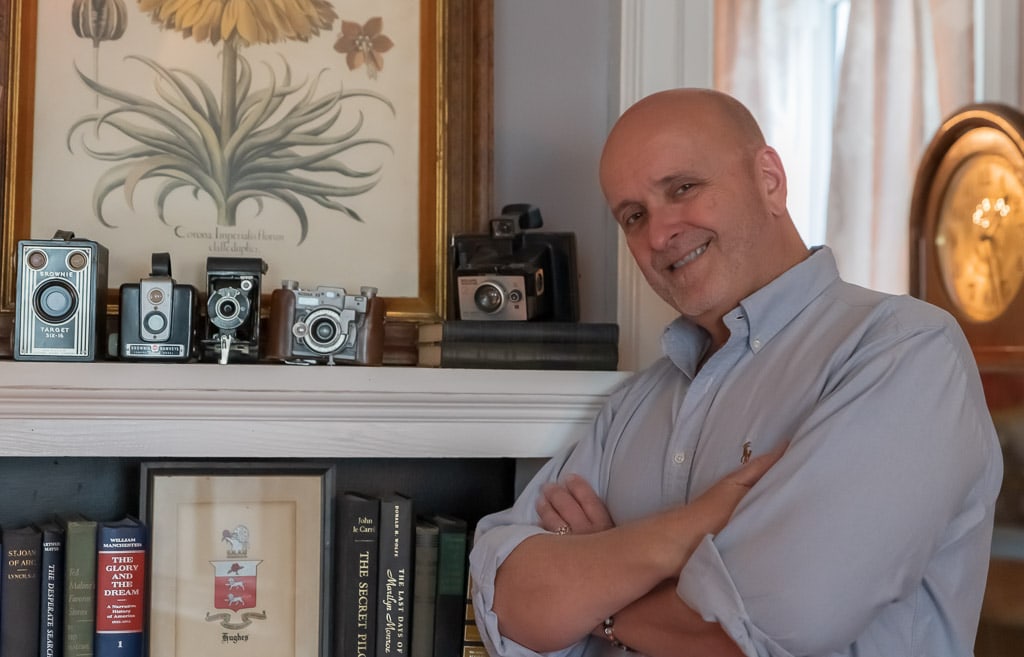 John Hughes, owner, with antique cameras, Gardner Farm Inn