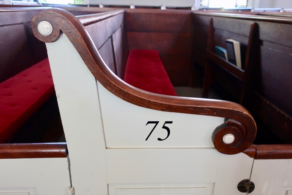 Mortgage Buttons on aisle seats First Parish Church Quincy MA