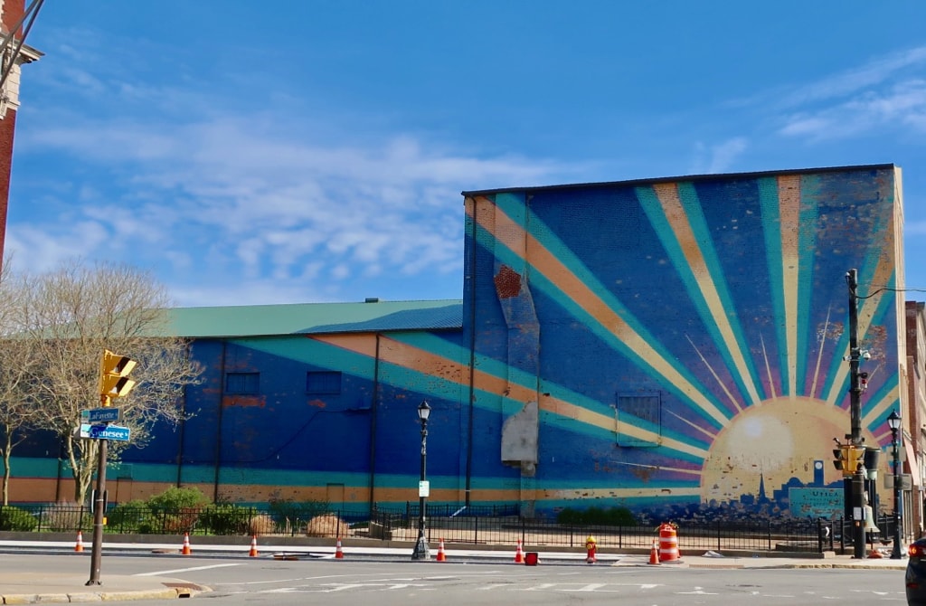 Utica rising - sun mural at entrance to I-90