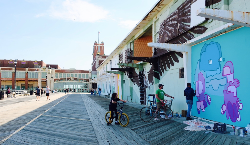 Muralist at work on the Asbury Park Boardwalk NJ