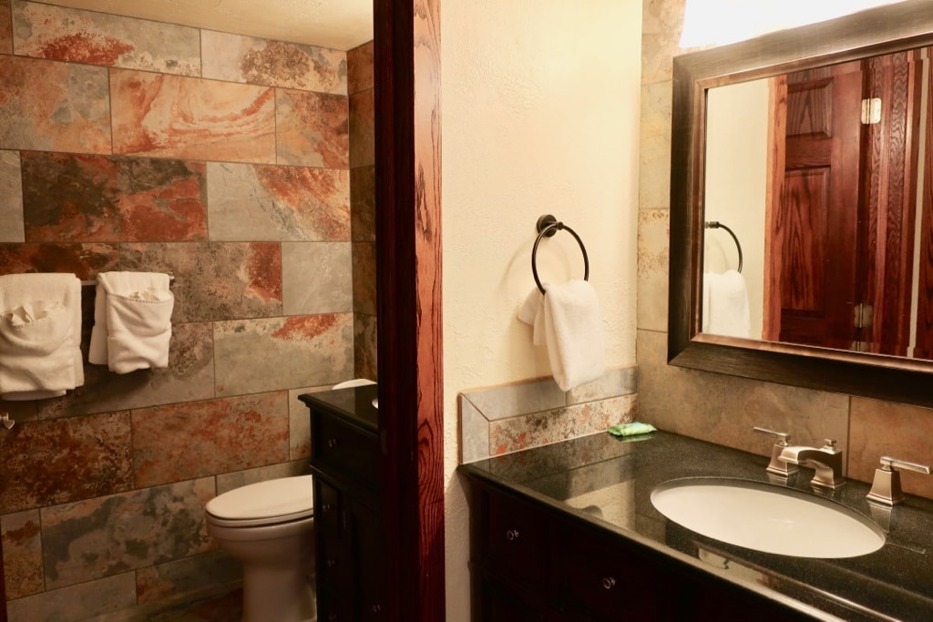 Artsy stone bathroom at Seven Springs Mountain Resort Hotel 