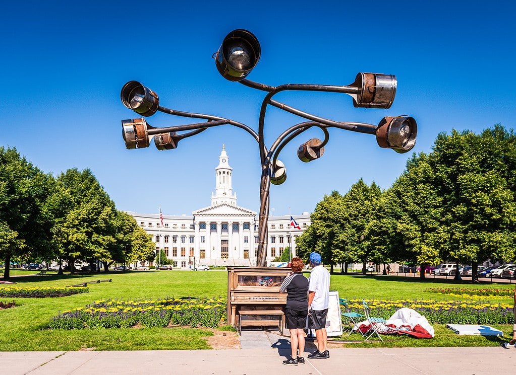 Couple In Downtown Denver admires art.