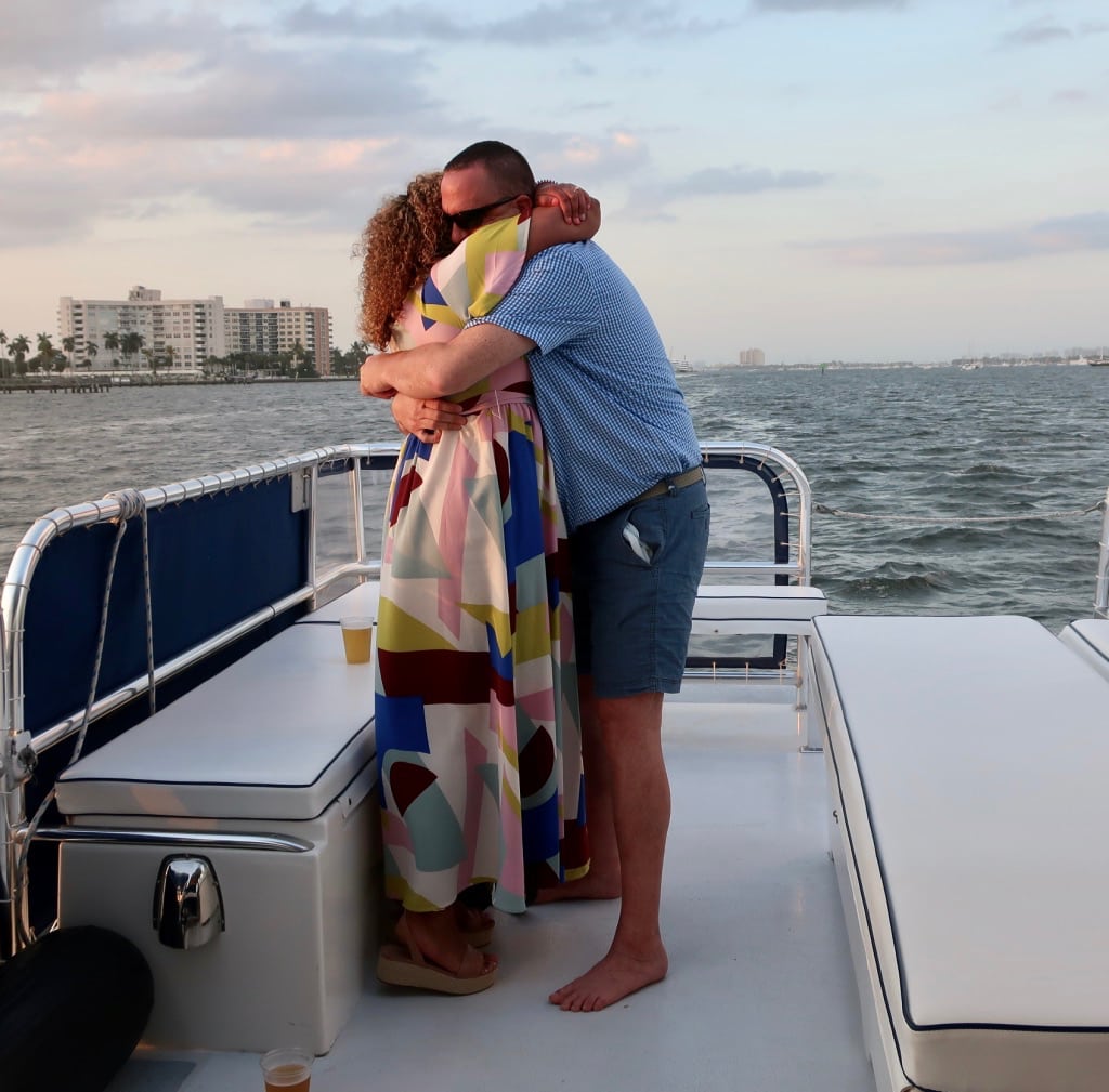 Newly engaged couple on Palm Beach sunset cruise