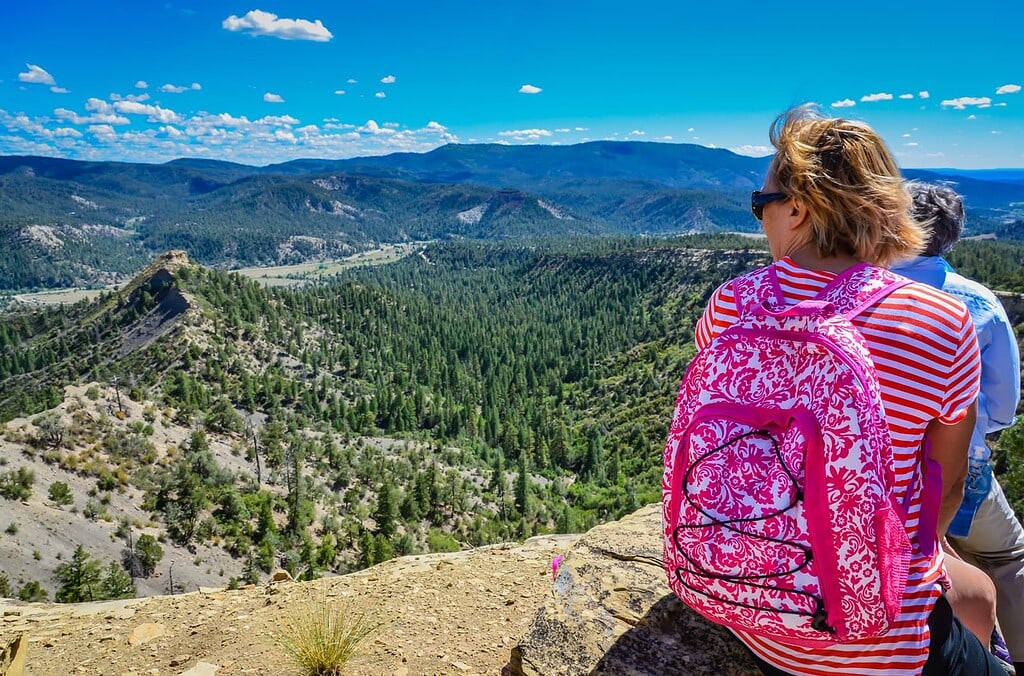 Couple looks out at Colorado mountain landscape