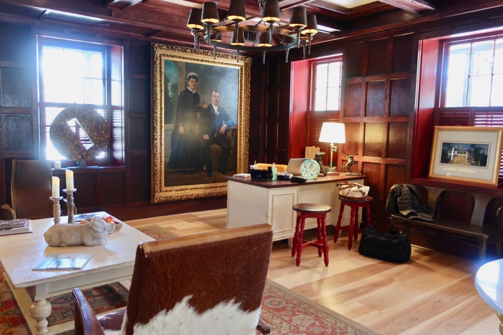 Check in desk with colonial couple portrait at Logan Inn 