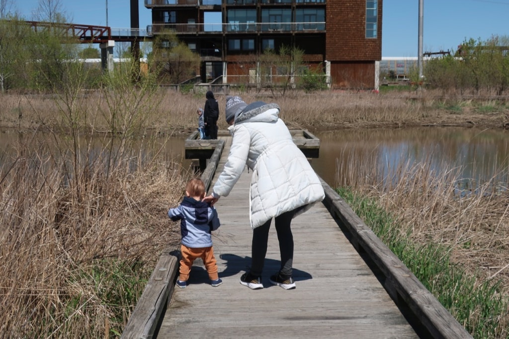 Mother and child explore marshland at DEEC Wilmington DE