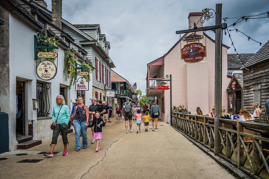Visitors walking the streets of the Colonial Quarter in St. Augustine