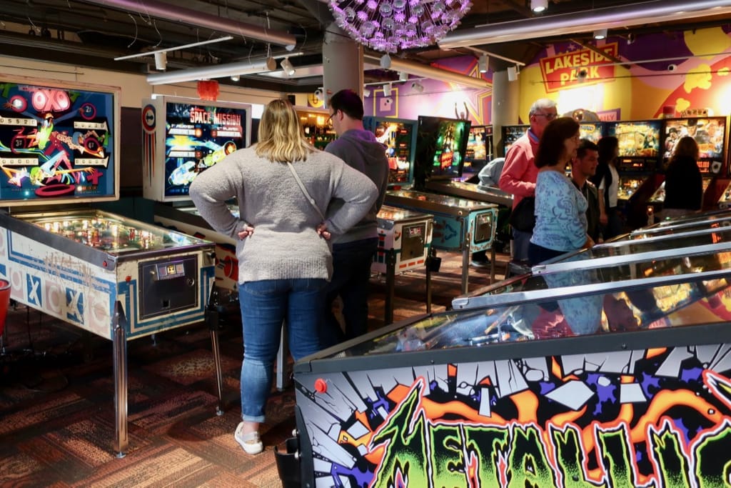 Couple at pinball machines Center in the Square Roanoke VA