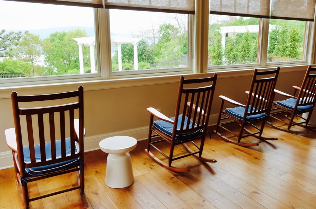 Rocking chairs overlooking Hudson River on Sunset Porch Abbey Inn NY